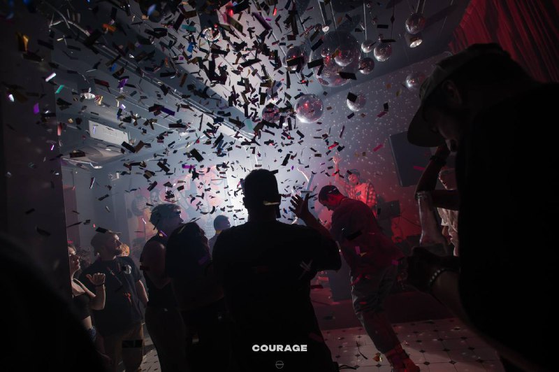 Guests dancing through confetti at Courage