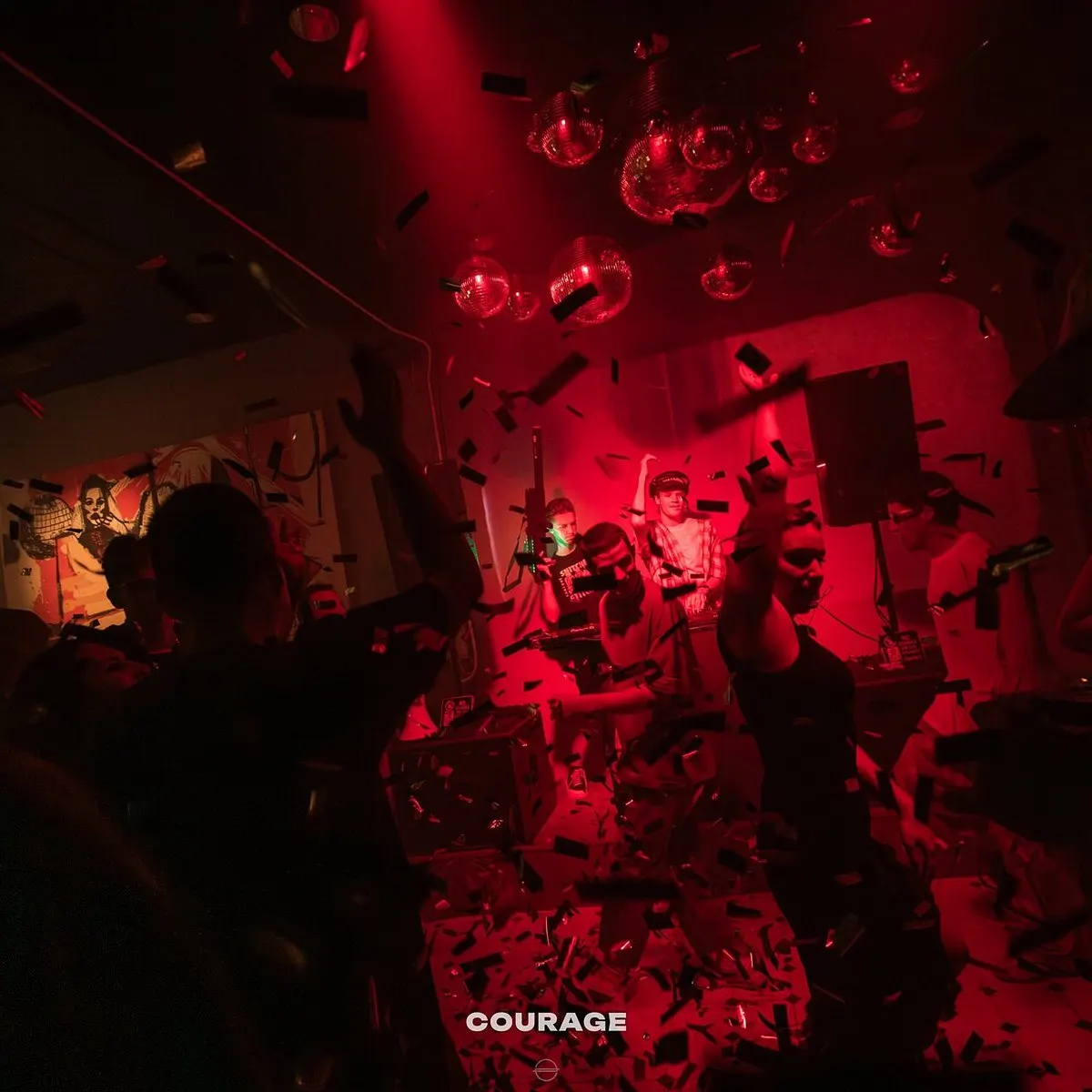 A red-lit party at Courage